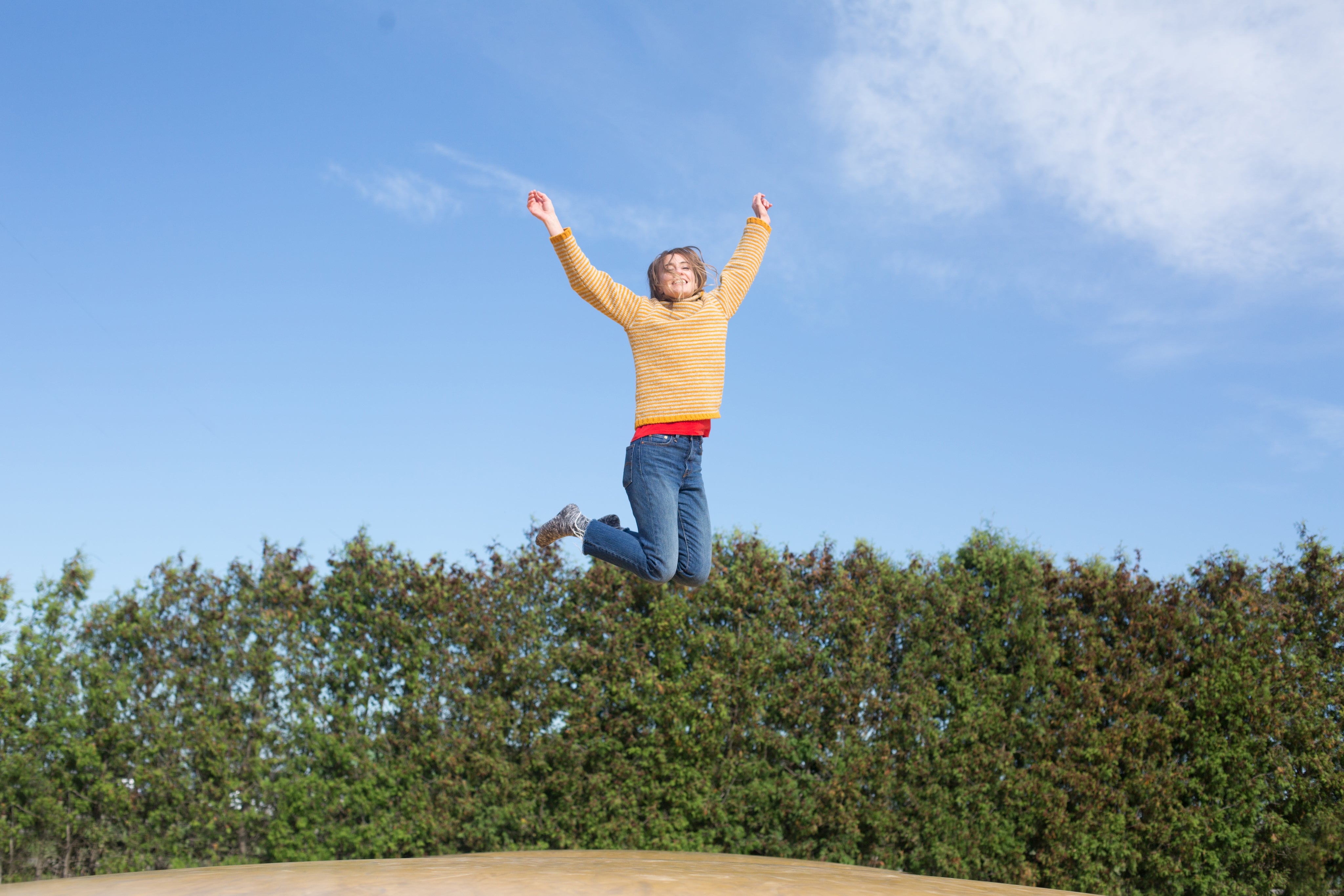 happy-woman-jumps-on-trampoline.jpg